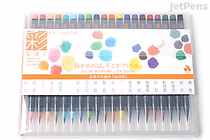 A set of 20 Akashiya Sai Watercolor Brush Pens arranged in a clear plastic case. The pens display a range of vibrant colors with brush tips visible, and the packaging includes colorful watercolor swatches and Japanese text.