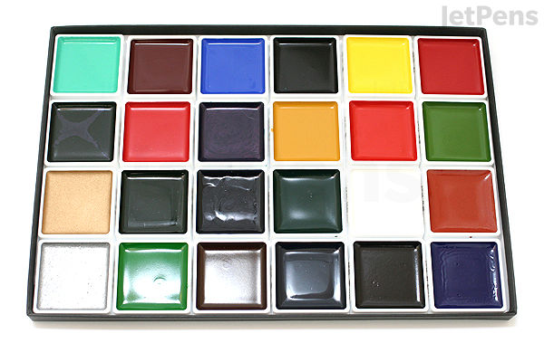 A 24-color Akashiya Gansai watercolor palette arranged in a rectangular plastic tray, featuring vibrant shades including greens, reds, blues, yellows, browns, blacks, and whites.