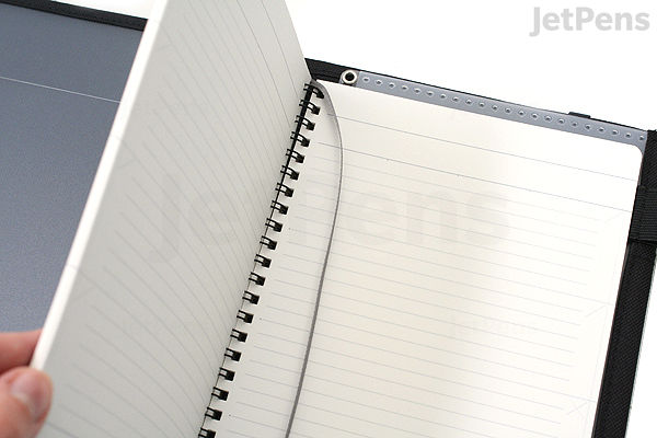 Open KOKUYO Systemic Cover Notebook with black fabric ring-bound cover, showing A5-sized lined pages with 6 mm spacing.
