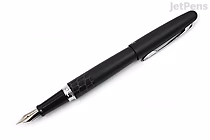 Black fountain pen with a fine nib, featuring a textured crocodile pattern on the barrel and a silver clip on the cap.