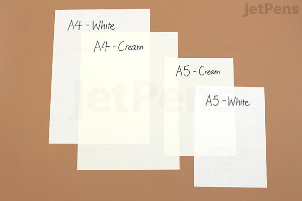 Four sheets of paper in different sizes and colors are displayed on a brown surface. From left to right: A4 white, A4 cream, A5 cream, and A5 white. Each sheet is labeled with its size and color. The papers are blank and have a smooth texture.