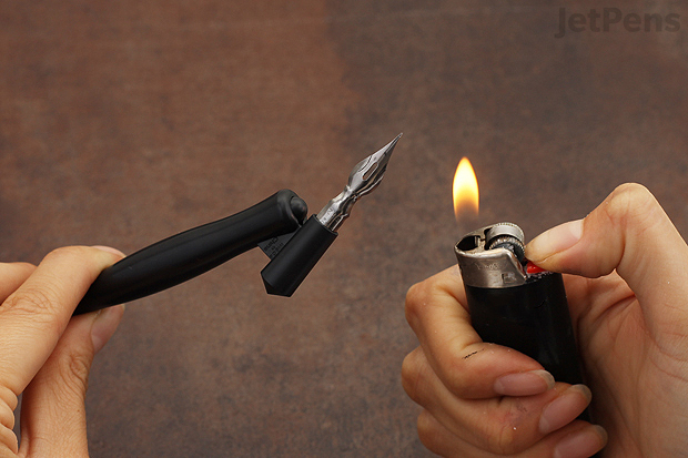 Burn the oil off with a lighter. Be careful when using fire.