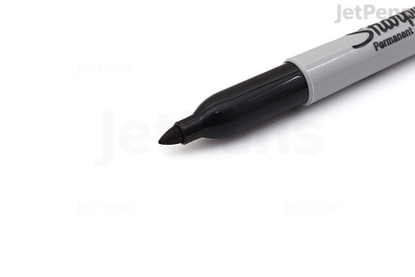 Close-up of a black Sharpie permanent marker with a fine point tip on a white background.