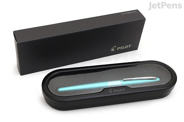 Image of a Pilot Metropolitan Retro Pop fountain pen in turquoise with a dotted pattern, displayed inside an open black case with a matching black outer box beside it. The pen has a fine nib.
