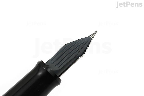 Close-up image of the nib of a Pilot Metropolitan Retro Pop fountain pen in gray houndstooth pattern, featuring a fine tip.