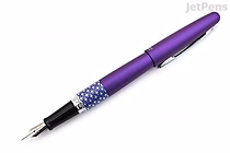 A Pilot Metropolitan Retro Pop fountain pen in purple with a fine nib, featuring a metallic purple barrel and a patterned grip section with white dots on a blue background.