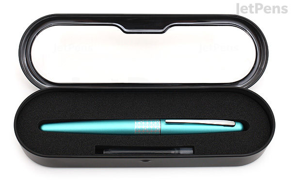 A turquoise Pilot Metropolitan Retro Pop fountain pen with fine nib, featuring a dotted pattern, displayed inside a black foam-lined case with a clear lid.