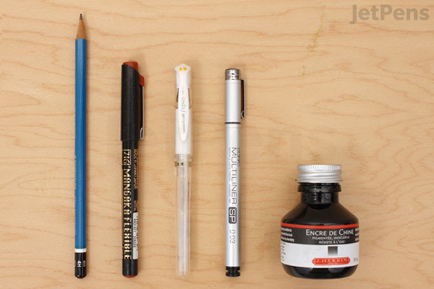 Range of tools compatible with watercolor, including pencil, white gel pen, several pens and a bottle of ink