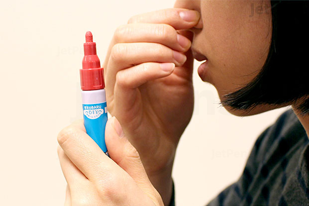 Person smelling a paint pen
