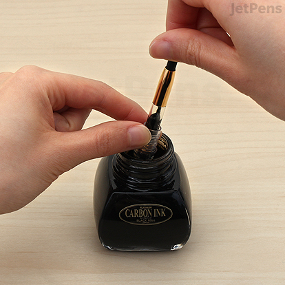Twist the converter upwards to draw ink.
