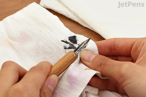 Linen cloths and cloth-like paper towels are less likely to deposit lint on your nib.