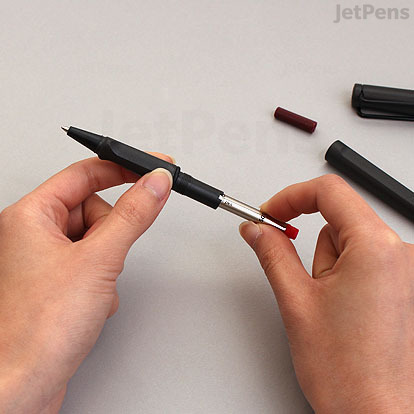 Place the refill inside the grip of the pen.
