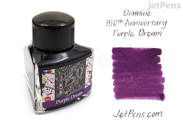 A 40 ml bottle of Diamine Purple Dream ink for the 150th Anniversary edition, shown next to a swatch of the vibrant purple ink on white background. The bottle has a black cap and a decorative label.