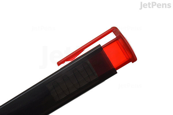 A close-up image of a Sakura Sumo Grip retractable eraser with a black body and a red translucent cap partially open, revealing the white eraser inside.