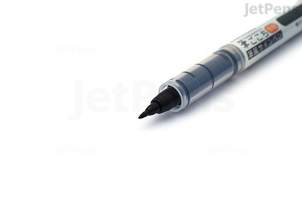 Close-up image of a Kuretake Fudegokochi brush pen with an extra fine black tip, shown against a white background.