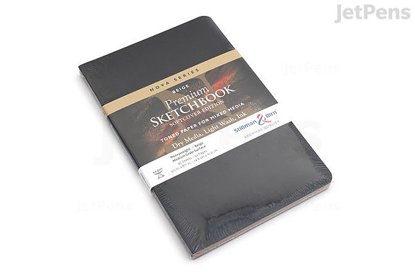 A Stillman & Birn Nova Sketchbook in softcover with black cover, measuring 5.5 by 8.5 inches, wrapped in a branded paper band.