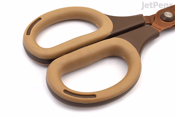 A close-up view of Nakabayashi Sakutto Cut Hikigiri scissors with a mocha-colored handle and titanium-coated blades. The handles have an ergonomic design with rounded edges and a smooth finish.
