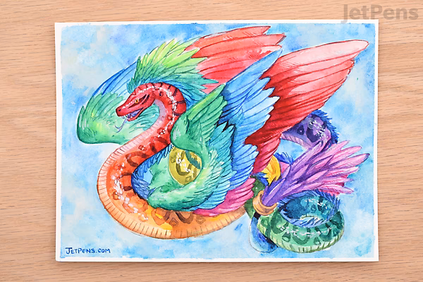 A vibrant watercolor painting of a colorful dragon with red wings, a green and orange body, and a blue and purple tail, set against a light blue background. The artwork showcases fluid brushstrokes and rich color blending.