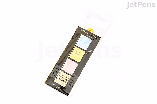 Pack of Midori Writing Marker Monthly Block Sticky Notes in a clear plastic sleeve with a black backing card, showing pastel-colored sticky notes arranged in blocks for memo or planning use.