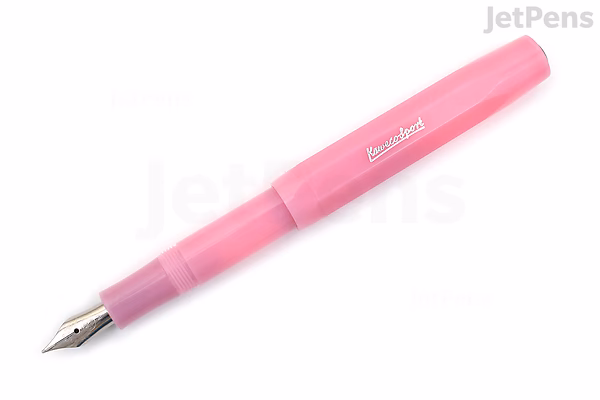 A Kaweco Frosted Sport fountain pen in blush pink color with a medium nib, shown uncapped and angled to display the nib and pen body.