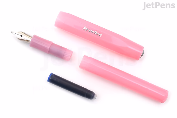 A disassembled pink Kaweco Frosted Sport fountain pen with a broad nib, shown alongside a black ink cartridge.