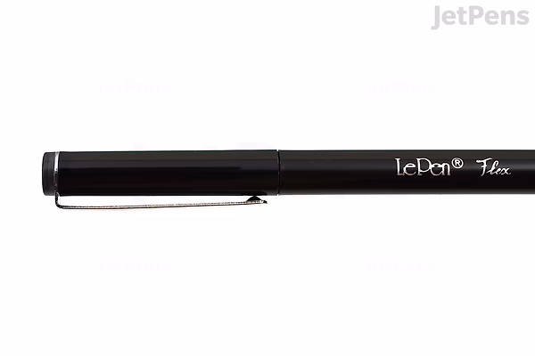 Black Marvy Le Pen Flex brush pen with a sleek design and a clip on the cap, shown against a white background.