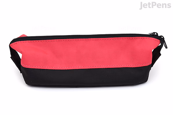 A pink and black pen case shaped like a small boat, with a zipper along the top.