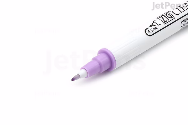 Close-up image of a Kuretake ZIG Clean Color Dot double-sided marker with a purple tip visible on one end of the white marker body.