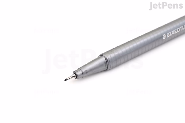 Close-up image of a Staedtler Triplus Fineliner pen with a 0.3 mm tip in lilac color, shown diagonally on a white background.