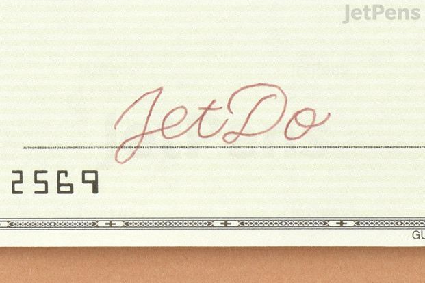 A check written in red-black ink.