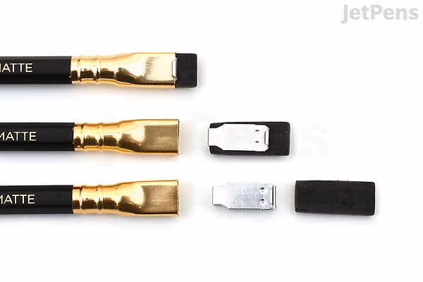 Three Blackwing 602 matte black pencils with gold ferrules and erasers, shown with their eraser caps removed and placed beside them on a white background.