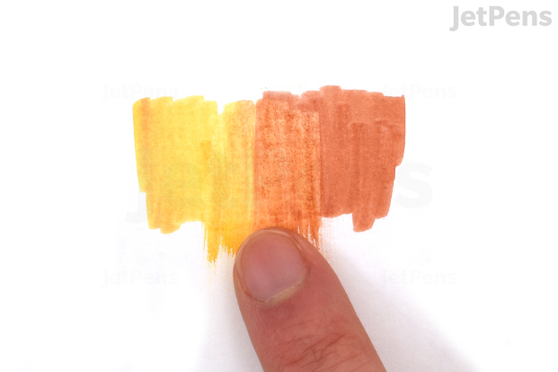 A blended swatch of Faber-Castell PITT Pen ink being smudged slightly with a finger.