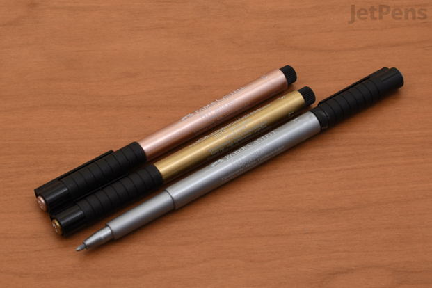 A lineup of all three colors of Faber-Castell PITT Metallic Artist Pens.