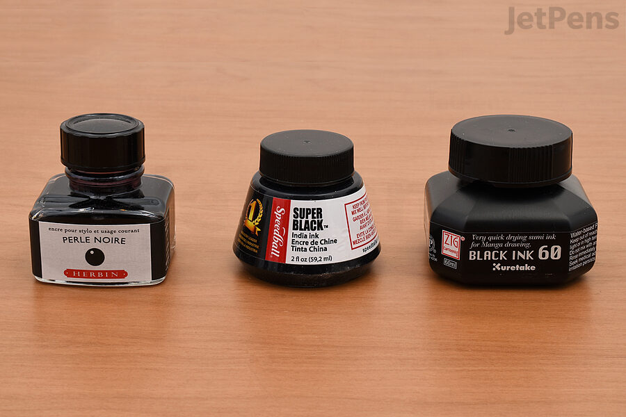 A selection of black inks: fountain pen ink, India ink, and manga ink.