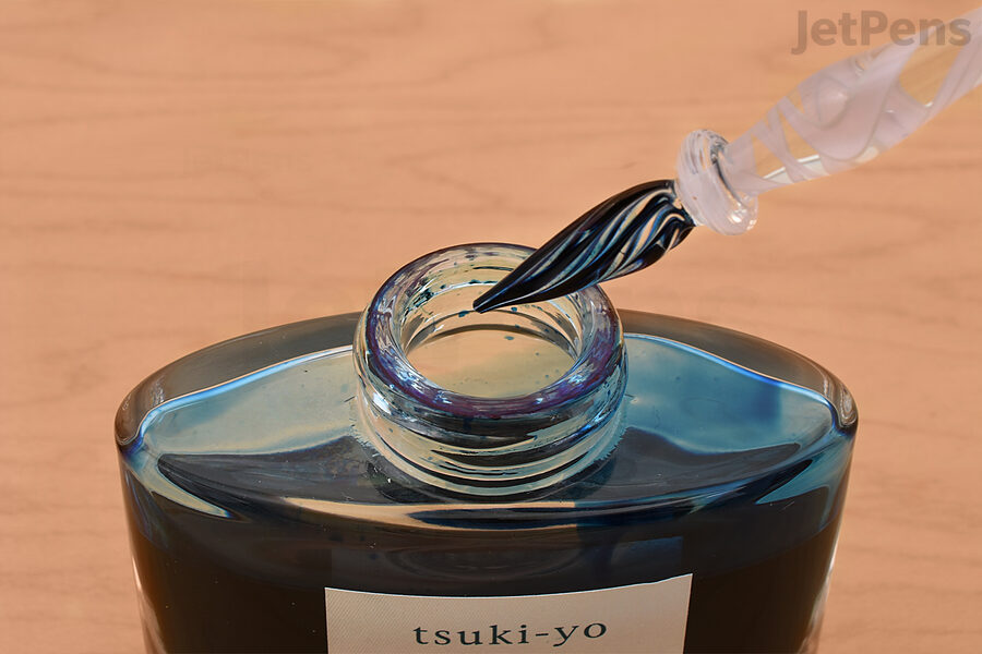 Dip a glass pen into your favorite ink.