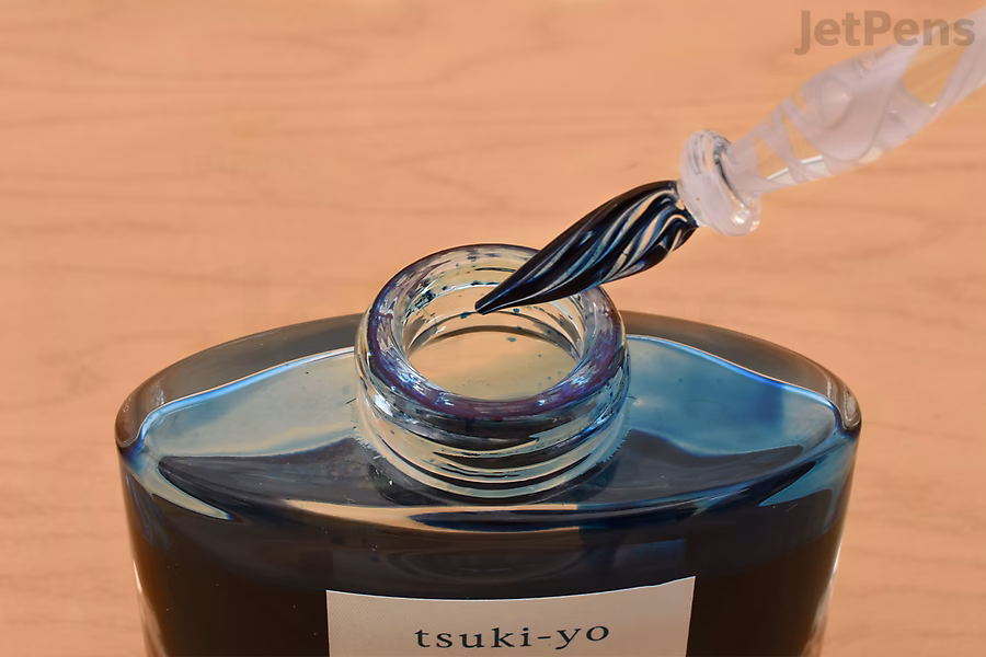 Dip a glass pen into your favorite ink.