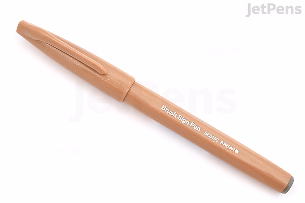 A Pentel Fude Touch Brush Sign Pen in pale brown color with its cap on, displayed on a white background.