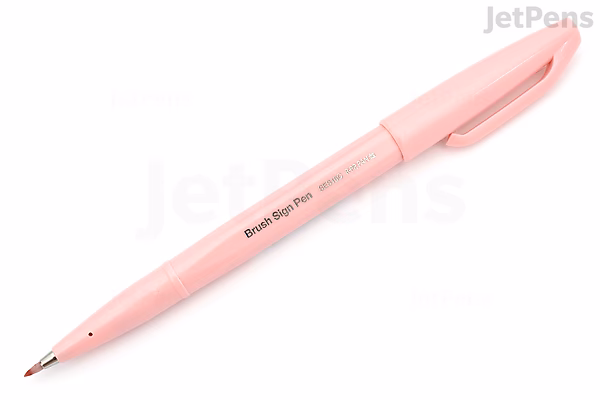 A pale pink Pentel Fude Touch Brush Sign Pen with a fine brush tip and a matching pink cap.