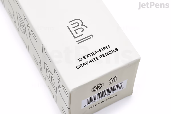 A white rectangular box labeled "12 Extra Firm Graphite Pencils" with the Blackwing logo on the top. The box is shown at an angle, highlighting the product description and barcode on one end.