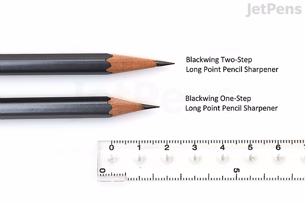 Two sharpened pencils next to a ruler, showing the difference between Blackwing Two-Step Long Point Pencil Sharpener and One-Step Long Point Pencil Sharpener, with the Two-Step creating a longer, more tapered point.
