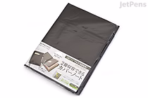 A black KOKUYO Systemic Cover Notebook, ring-bound with a fabric cover, in semi B5 size with 6 mm ruled pages, shown in its original packaging.