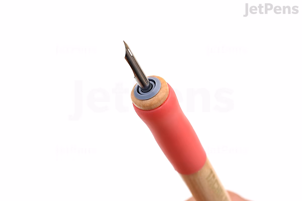 Close-up image of a Tachikawa T-36 nib holder with a pink grip and a metal nib attached, shown against a white background.