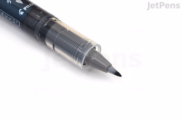 Close-up image of a Pilot Shunpitsu Pocket Brush Pen with a double-sided design, featuring a black brush tip visible at the front. The pen body is transparent, showing the ink reservoir inside.