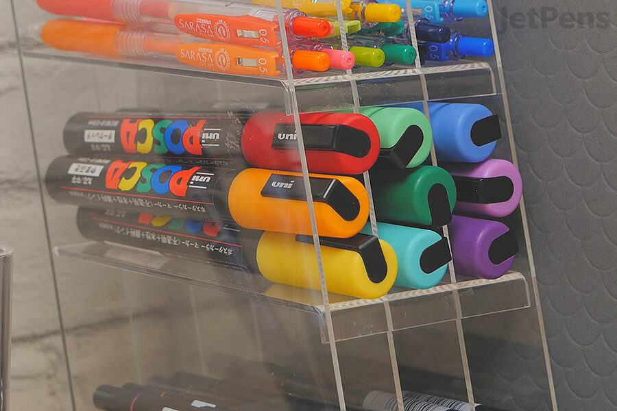 Paint markers use a thicker, paint-like ink that can flow out of the tip. They should be stored horizontally.