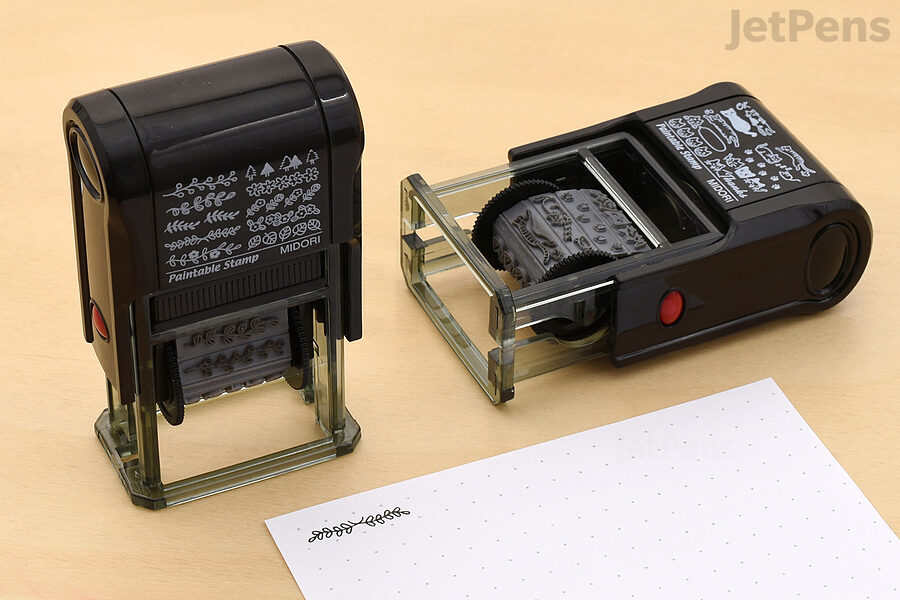 A few Midori Self-Inking Paintable Stamps with the corner of a page, example stamping