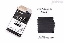 A box of Pilot black ink cartridges with five cartridges visible inside. Next to the box is a sample of black ink strokes labeled "Pilot Namiki Black" and "JetPens.com."