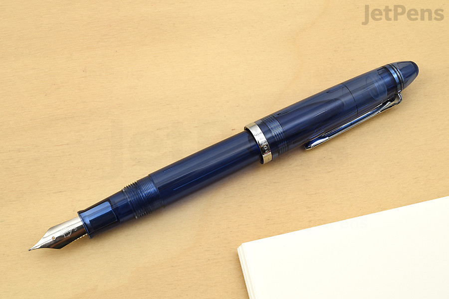 The Sailor Compass 1911 has a transparent body and feed, as well as a converter that matches the color of the pen.
