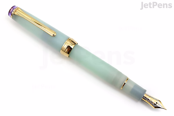 A Sailor Pro Gear Slim Shikiori fountain pen in a soft pastel green color called Haru-same (Spring Rain), featuring gold accents and a 21k medium fine nib.