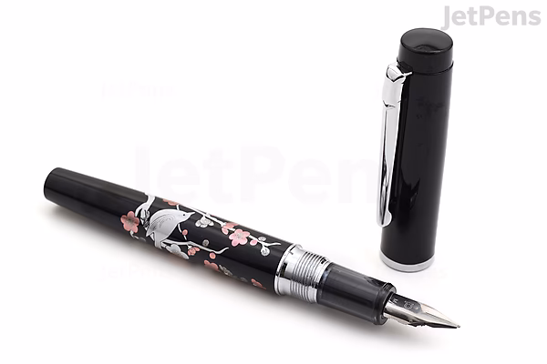 A Platinum Procyon Maki-e fountain pen with a fine nib, featuring a detailed brush warbler bird design perched on a plum tree branch. The pen is black with silver accents, and the cap is placed beside the pen. This is a limited edition model.