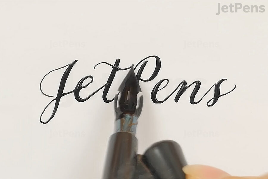 Pointed pen calligraphy created with Kuretake Sumi Ink.